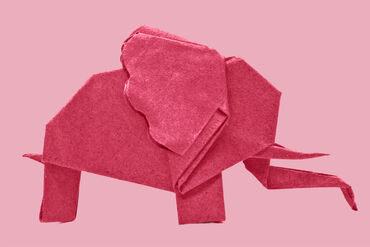 A paper folded pink elephant.