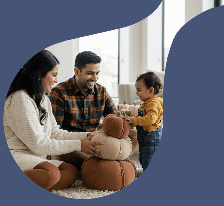 Expecting family decorating for fall with their baby smaller desktop