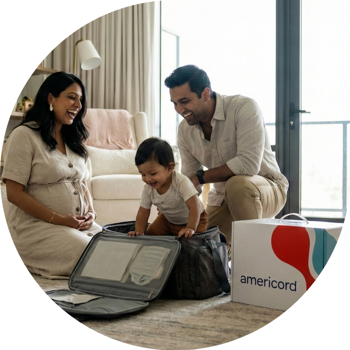 Parents packing their hospital bag with baby climbing in go bag with americord colleciton kit